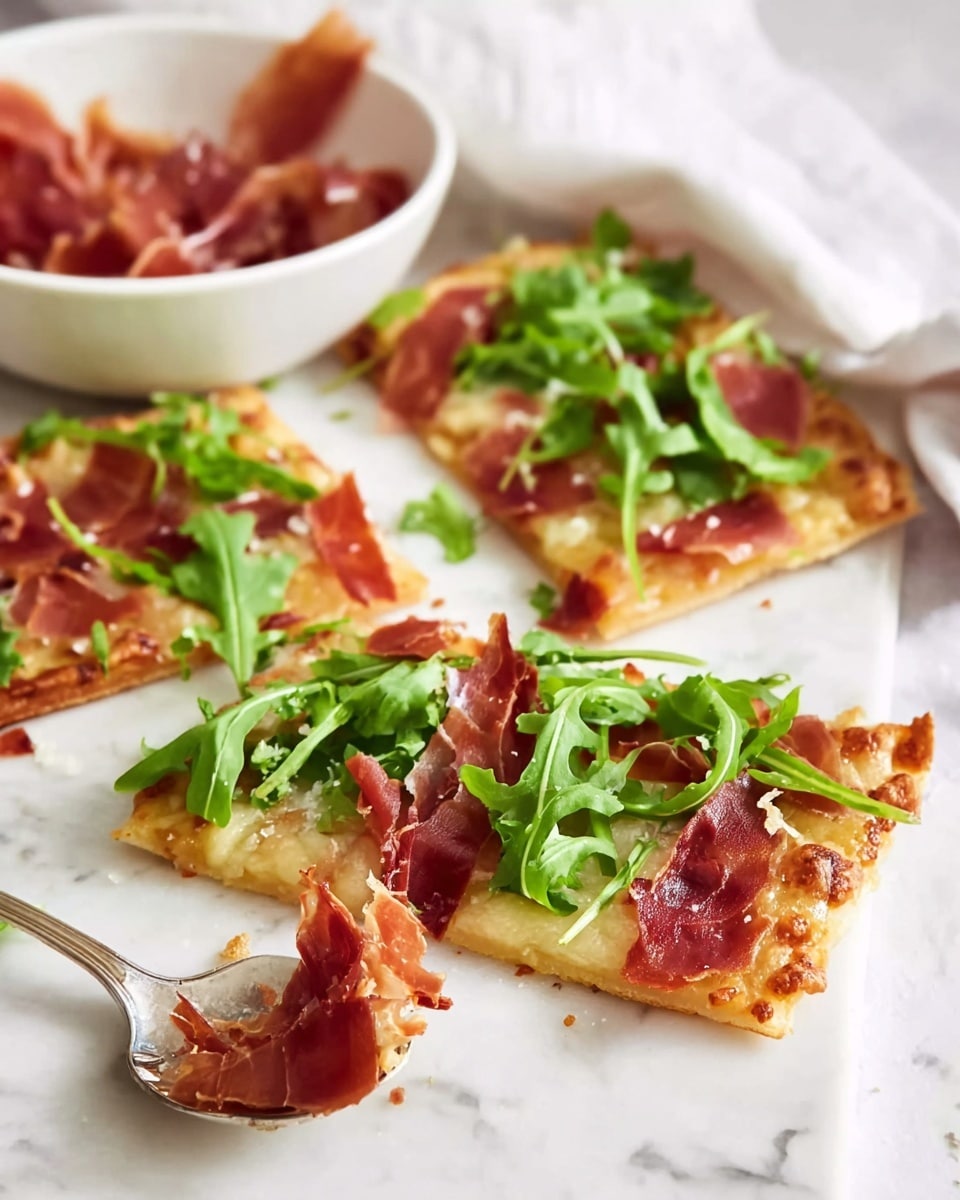 The image shows three rectangular pieces of thin-crust pizza placed on a white marbled surface. The base layer is a crispy light golden crust. On top, there is a layer of melted pale yellow cheese, followed by thin slices of crispy reddish-brown prosciutto scattered unevenly. Fresh bright green arugula leaves are spread across the top, adding a fresh look. In the background, there is a white bowl filled with extra pieces of prosciutto. A silver spoon with some bits of prosciutto rests in the foreground. Photo taken with an iphone --ar 4:5 --v 7