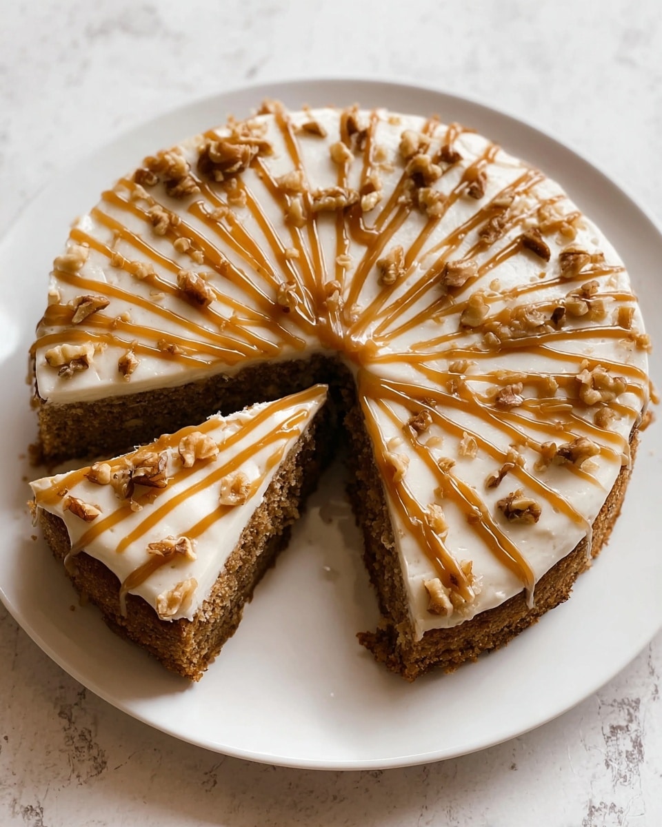 The image shows a round cake with one slice cut out, placed on a white plate. The cake has one thick brown layer with a moist, crumbly texture. On top, there is a smooth white frosting layer evenly spread. Drizzled on the frosting are thick caramel-colored lines radiating from the center to the edges, and small pieces of walnut are scattered over the top, adding a crunchy texture. The cake sits on a white marbled surface. photo taken with an iphone --ar 4:5 --v 7