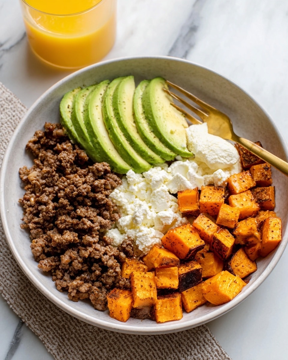 The image shows a white bowl with four main layers of food arranged side by side. On the left, there is a portion of cooked ground meat with a brown color and crumbly texture. Next to it, thin slices of green avocado are fanned out neatly. To the right of the avocado, there is a scoop of white cottage cheese with a lumpy texture. Lastly, on the far right, there are small cubed pieces of sweet potatoes with an orange color and slightly crispy edges. A golden spoon is placed inside the bowl. The bowl rests on a white marbled surface with a glass of orange juice visible in the background. Photo taken with an iphone --ar 4:5 --v 7